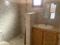 a-vendre-a-ngaparou-deux-villas-tres-bien-situee-proche-de-la-route-et-de-locean-sur-un-terrain-de-220m2-small-3